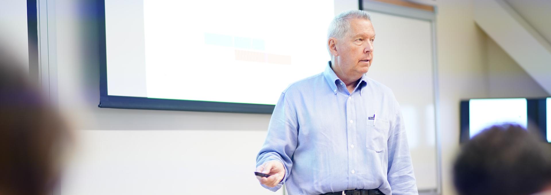 Professor teaching in Gallagher Hall