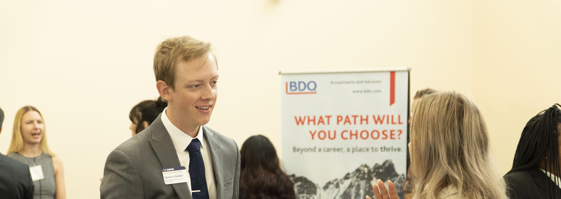 Man talking to woman