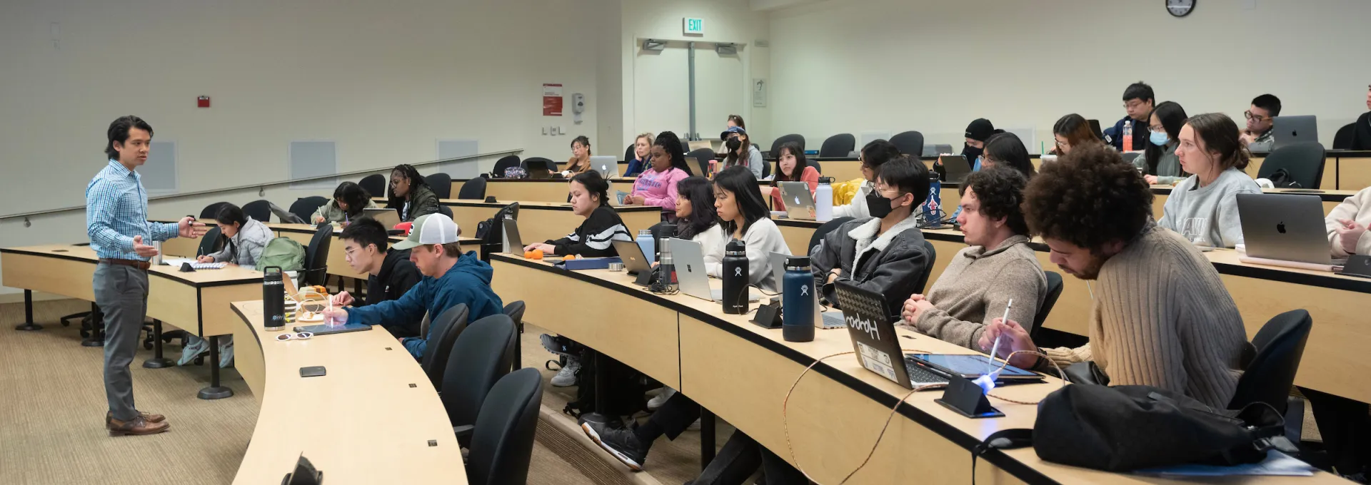 Students in a classroom, Paul Wong teaching