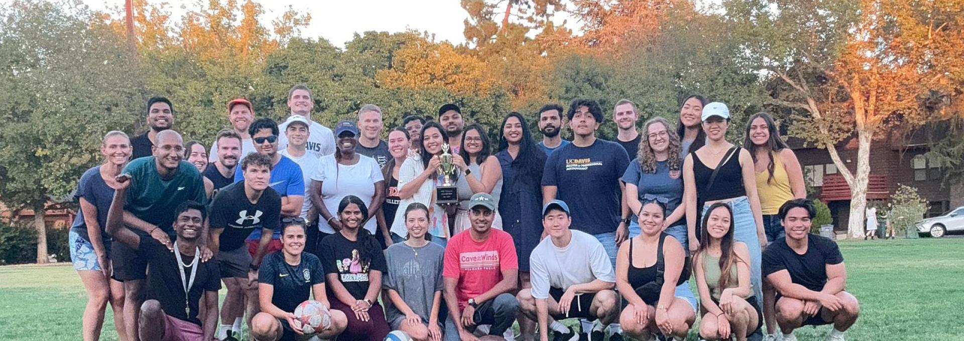 Students posing for a photo in a field at the 2024 GSM olympics