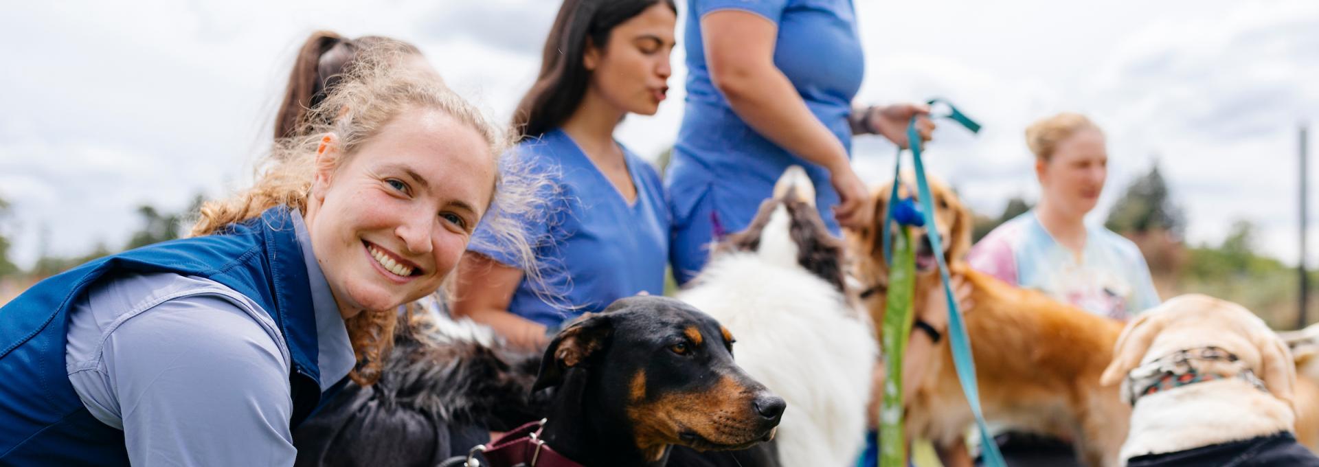 Dogs and two vet students at UC Davis Veterinary Medicine
