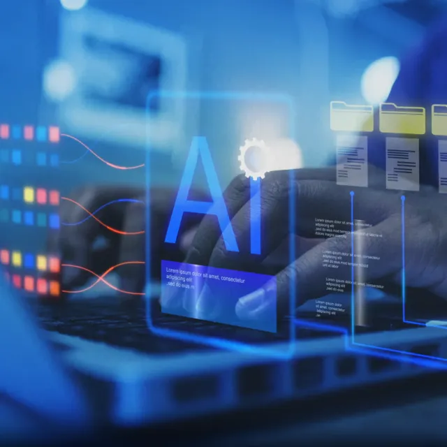 Hands typing on a laptop keyboard with digital graphics of AI, data streams, and folder icons overlaying the image, representing artificial intelligence and data processing.