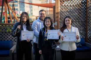MSBA Hackathon winners hold up their certificates 