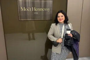 Marisol Ibarra standing in front of Moet Hennessay