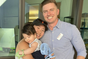 Jason Bartus with wife and son