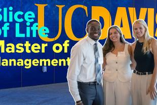 Three MM Students in front of a UC Davis sign