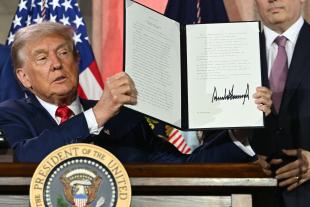 President Trump in Oval Office signing executive order on AI