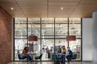 People sit outside of the Tech Foundry, a makerspace at Aggie Square that designs and manufactures devices to support research and solve problems.