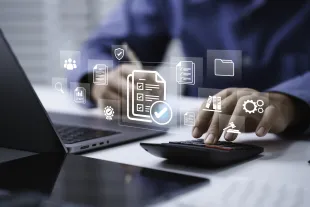 Person using a calculator and laptop at a desk, with digital icons for documents, analytics, and data management overlaid on the image.