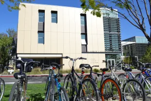 Bicycles parked in front of the Maurice J. Gallagher Jr. Hall building at the Graduate School of Management.