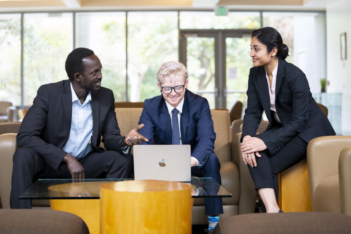 Group of diverse students in Gallagher Hall lobby