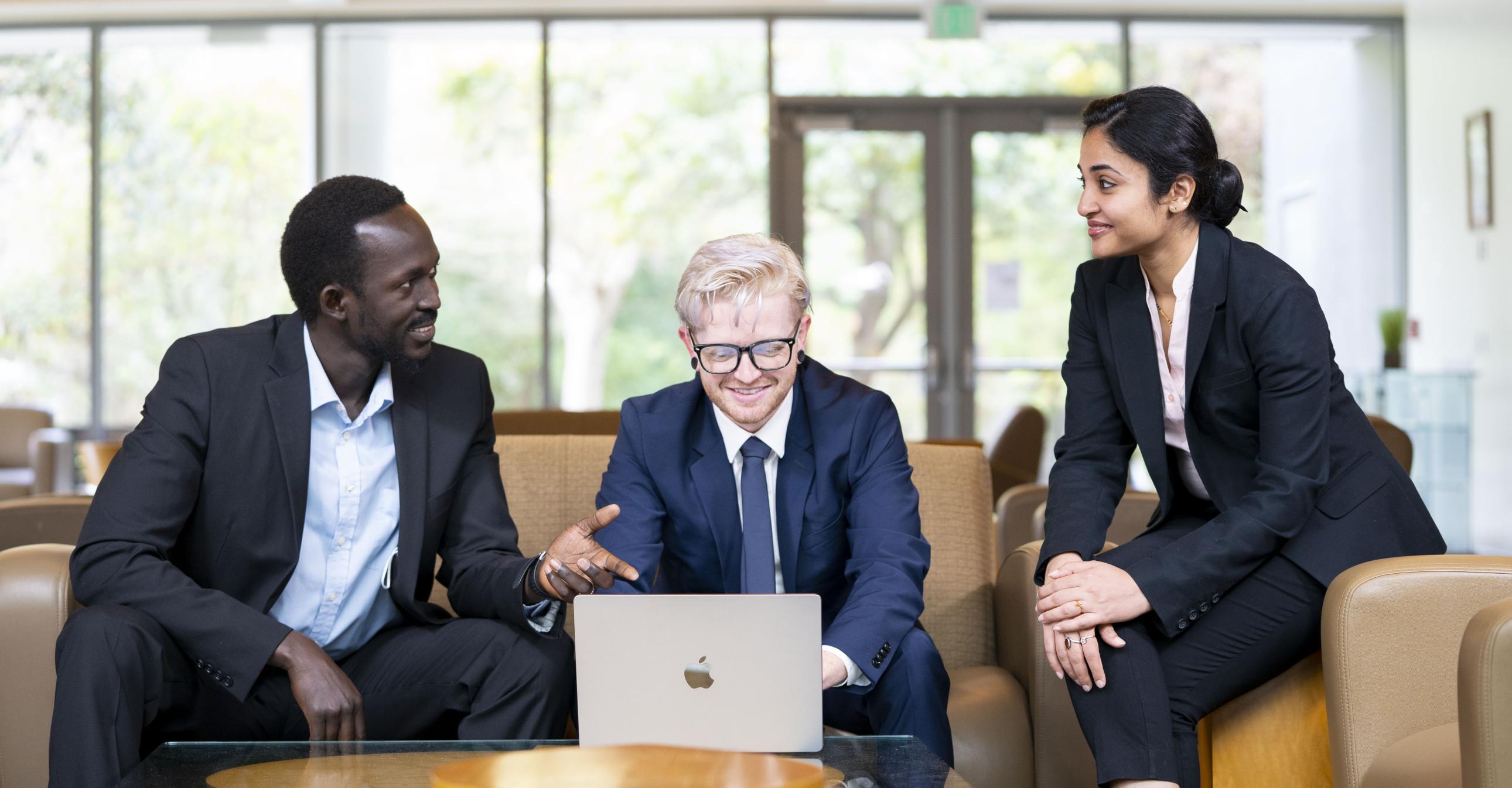 Group of diverse students in Gallagher Hall lobby