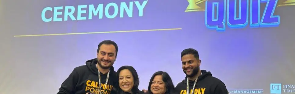 Four Cal Poly Pomona students holding up their award