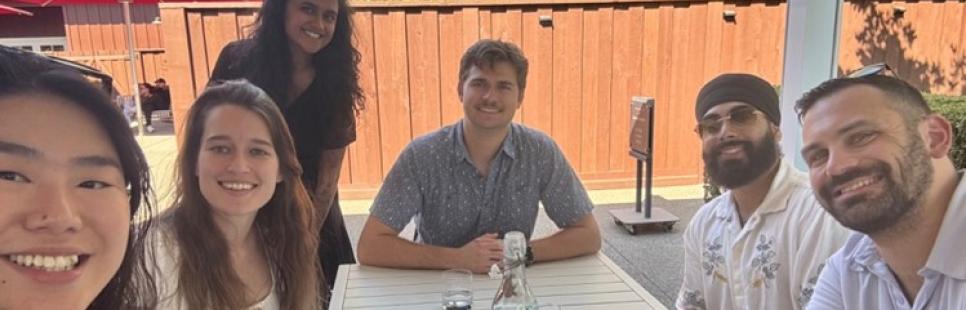 MBA students sit on an outside patio at a winery