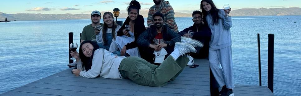 MBA students pose on a pier in Lake Tahoe