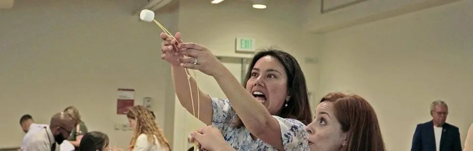 2023 Leadership Academy participants doing a marshmallow tower exercise