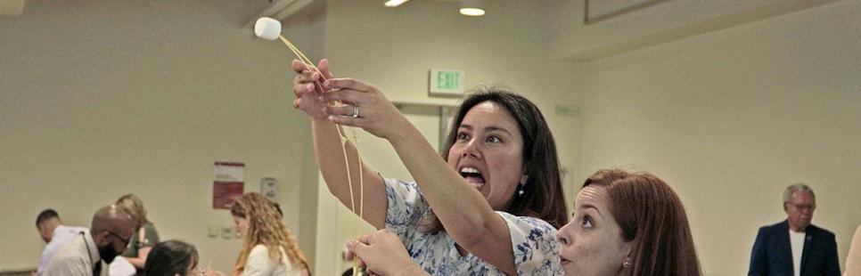 2023 Leadership Academy participants doing a marshmallow tower exercise
