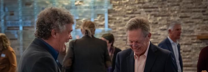 Maurice J. Gallagher Jr. signs copies of his book during a reception at Gallagher Hall after his UC Davis speaker event.