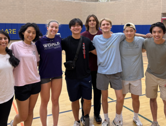 UC Davis students pose for a group photo inside the ARC gym after a volleyball game.