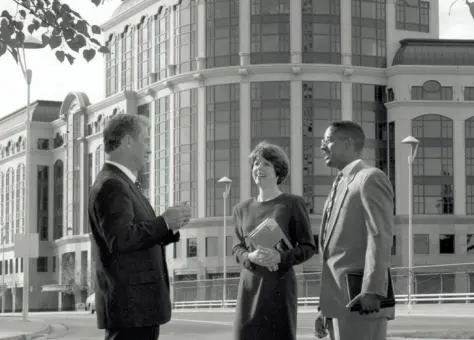 Dean Robert Smiley talking with students outside of One Capital Mall