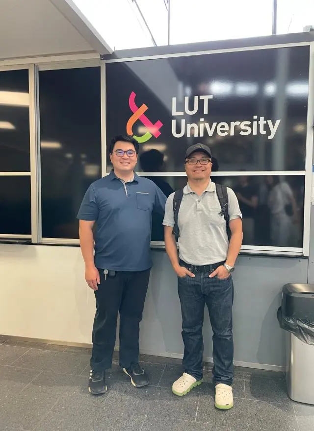 People in front of LUT University sign