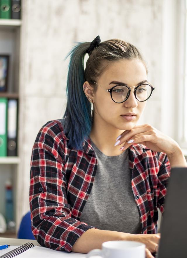 woman looking at laptop