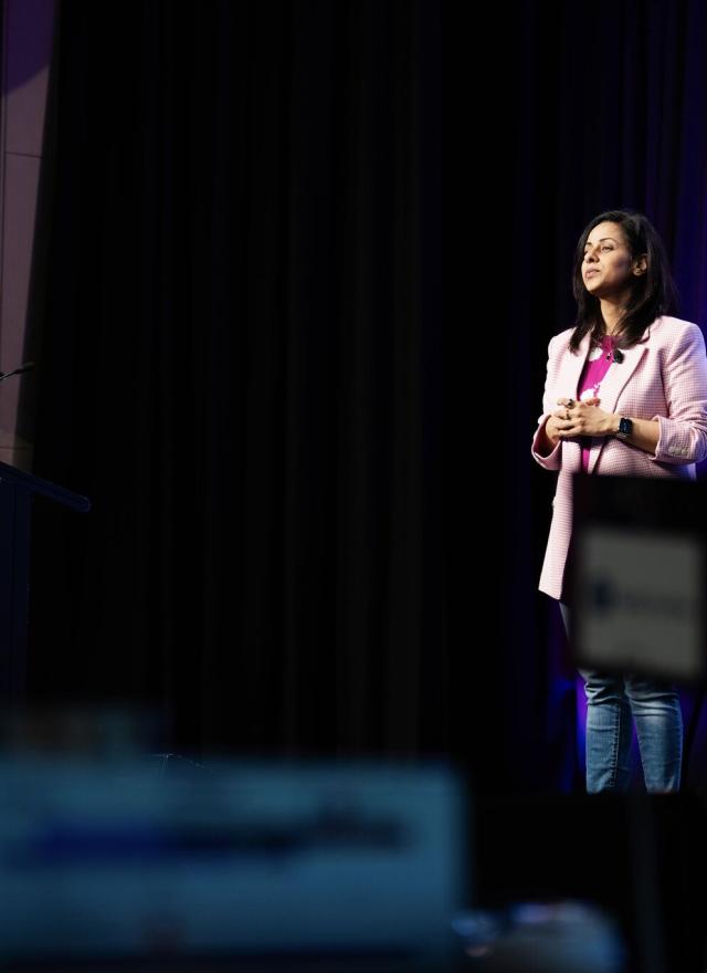 Shilpi Sharma on stage at a conference