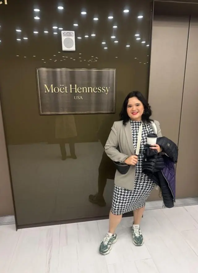 Marisol Ibarra standing in front of Moet Hennessay