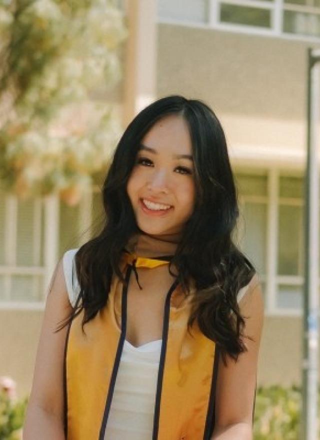 Diana Tran wearing a graduation stole