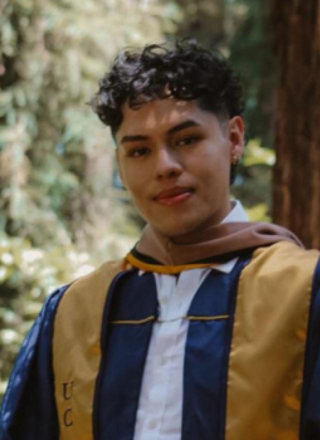 Eduardo Casarubias wearing a graduation robe