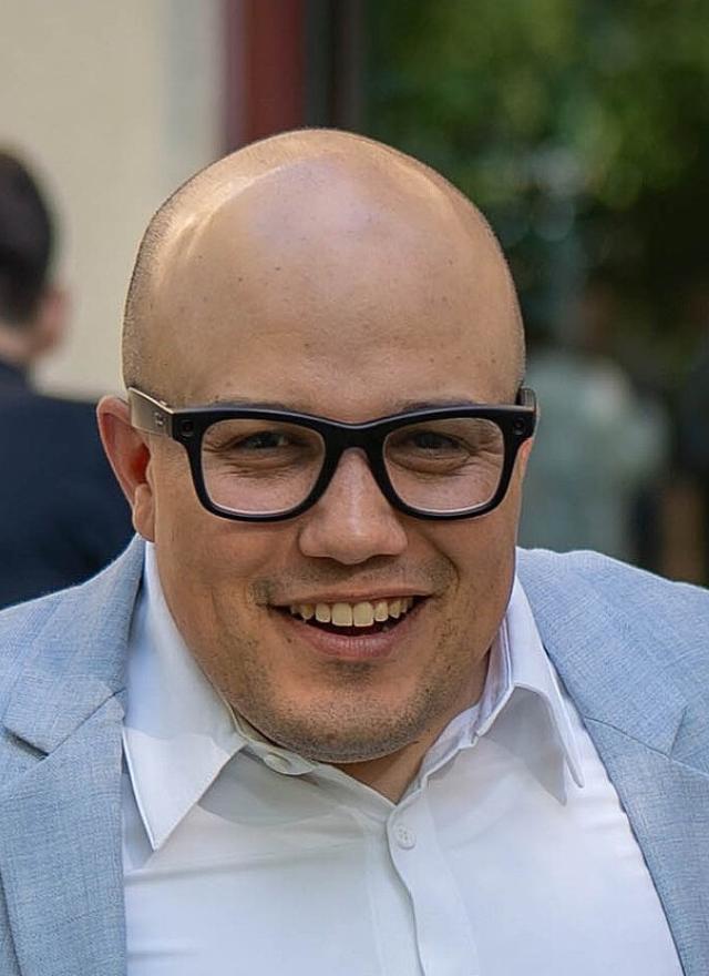 Caleb Cavazos and two other alumni at the 2025 reunion