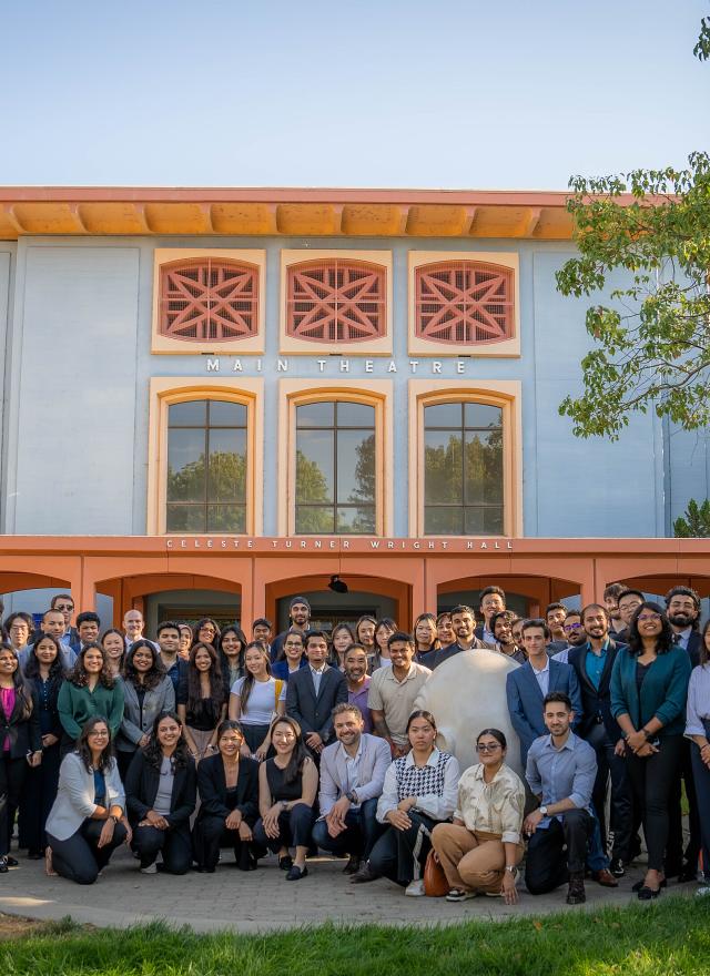 New 2025 MSBA students pose for a group photo in front of a theater on the UC Davis campus