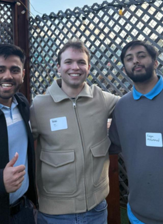 Vatsal Nanawati, Henri Jenoudet and Furqan Mohammed standing in a patio