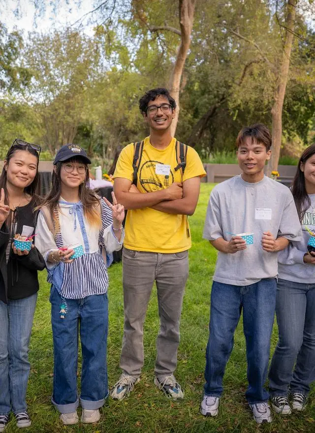 Business major students at an event on campus