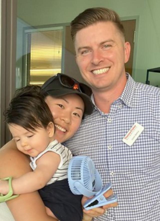 Jason Bartus with wife and son