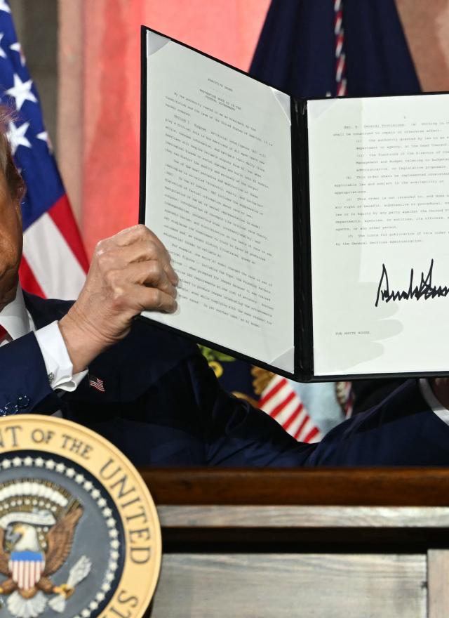 President Trump in Oval Office signing executive order on AI