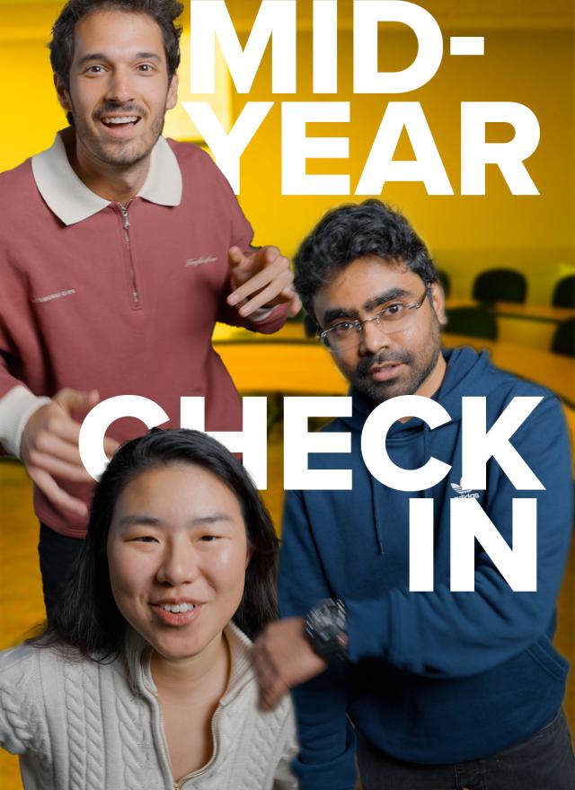 Three people facing the camera in a meeting room with "MID-YEAR CHECK IN" written in large white letters over the image.