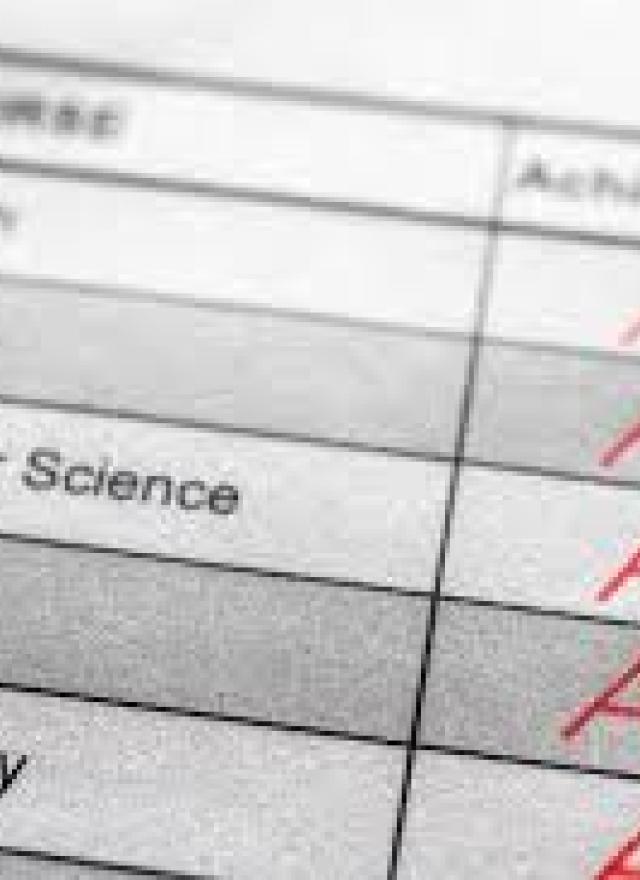 A close-up of a report card showing subjects like Algebra, Computer Science, Biology, and World History with A+ grades in the achievement column.