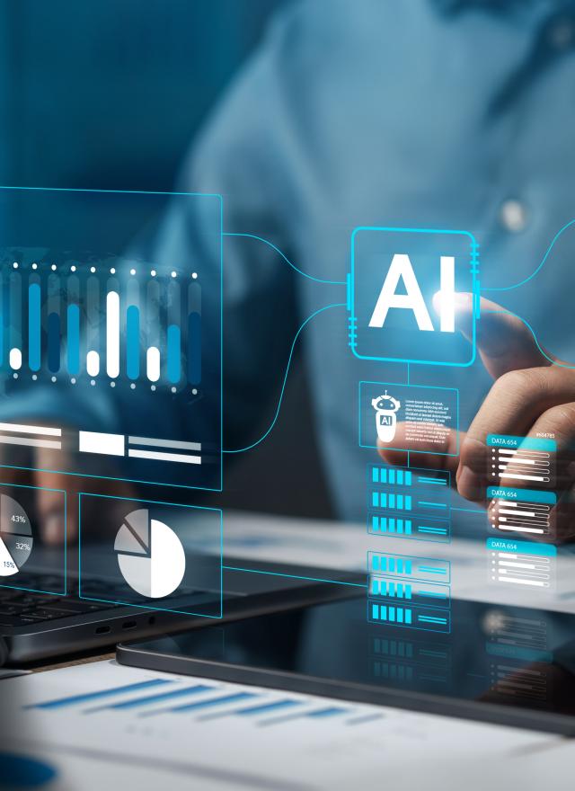 Person using a laptop and tablet, interacting with virtual AI-themed data graphics and analytics charts projected in the air.