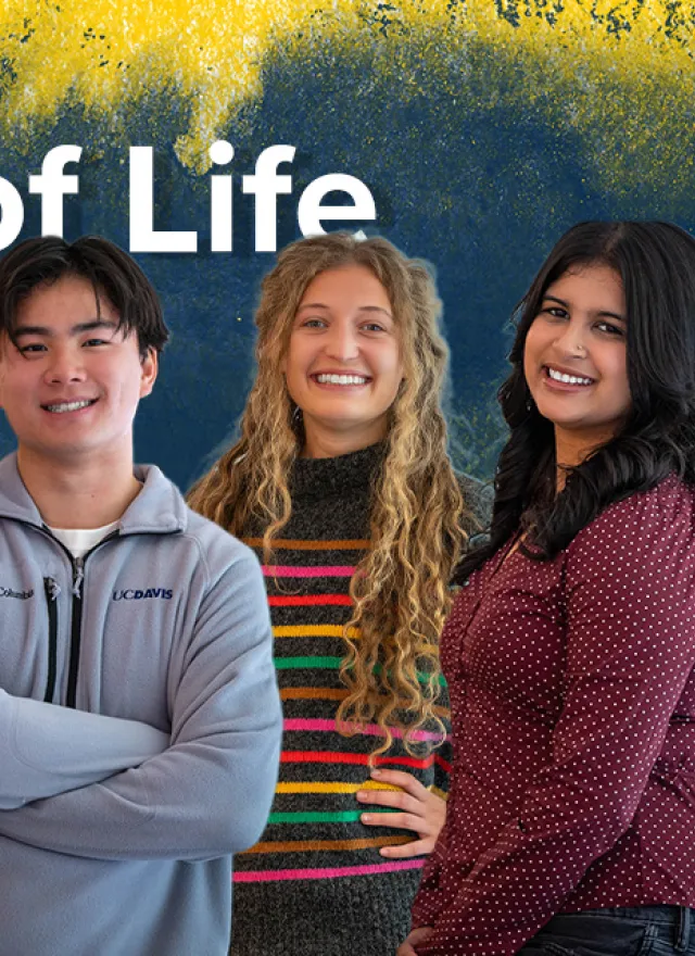Three people standing and smiling in front of a blue and yellow painted background with the text “Slice of Life MPAc” displayed.