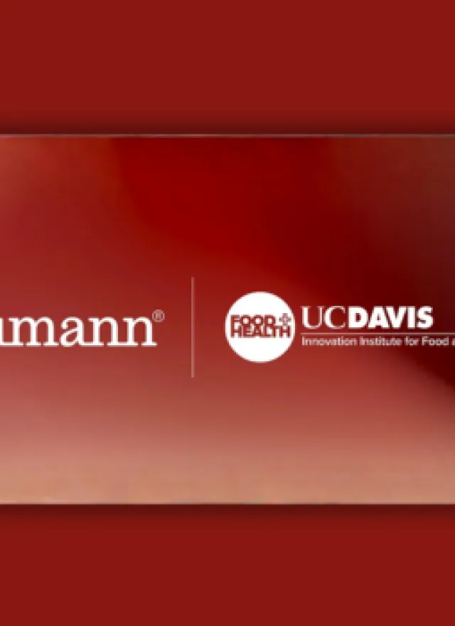 A rectangular banner with “humann” on the left and “UC Davis Innovation Institute for Food and Health” with its logo on the right, set against a reddish gradient background.