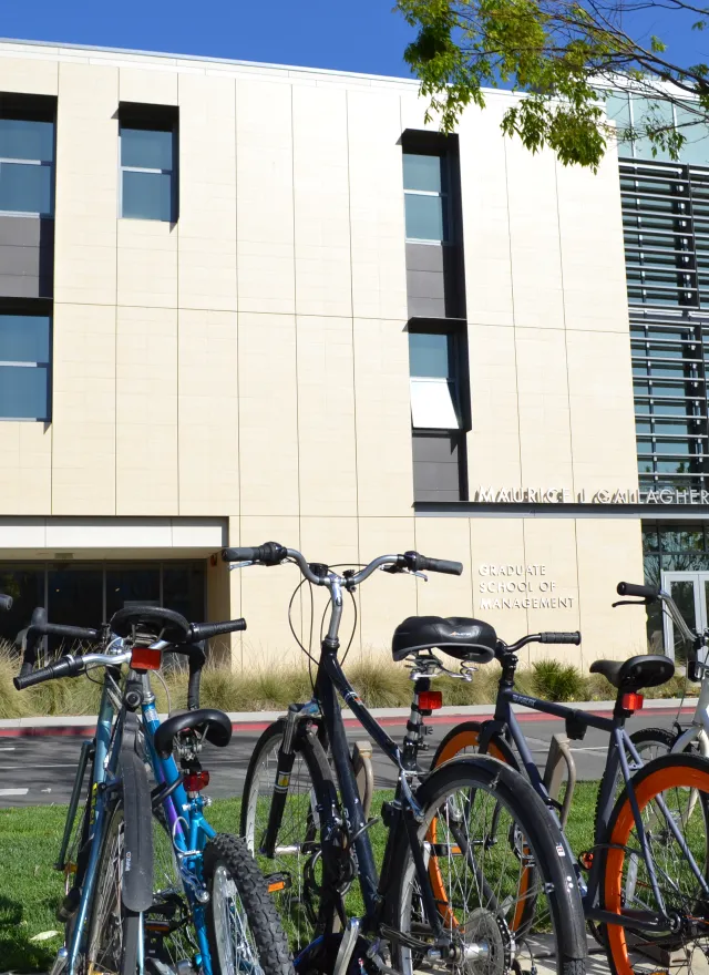 Bicycles parked in front of the Maurice J. Gallagher Jr. Hall building at the Graduate School of Management.