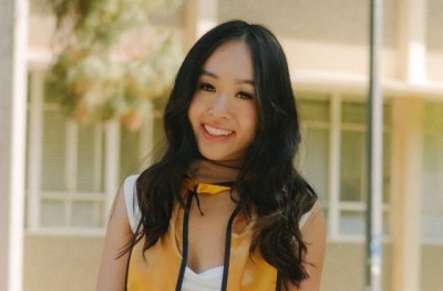 Diana Tran wearing a graduation stole
