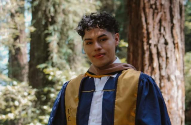 Eduardo Casarubias wearing a graduation robe
