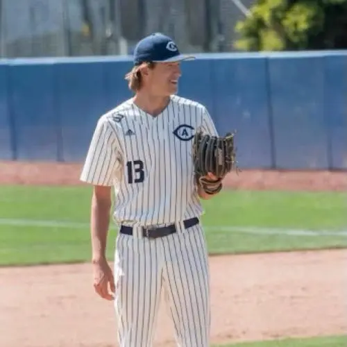 Carter Delaney wearing a baseball uniform and standing on the pitcher's mound