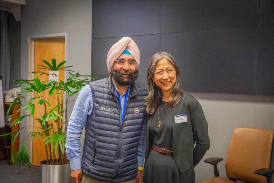 Jagdeep Singh Bachher and AyakoYasuda standing side by side