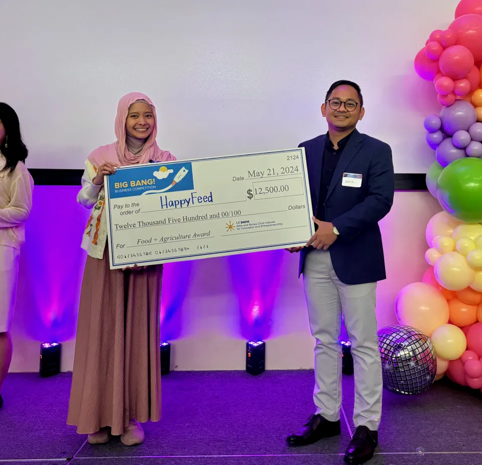 Galih Setiawan holding up check