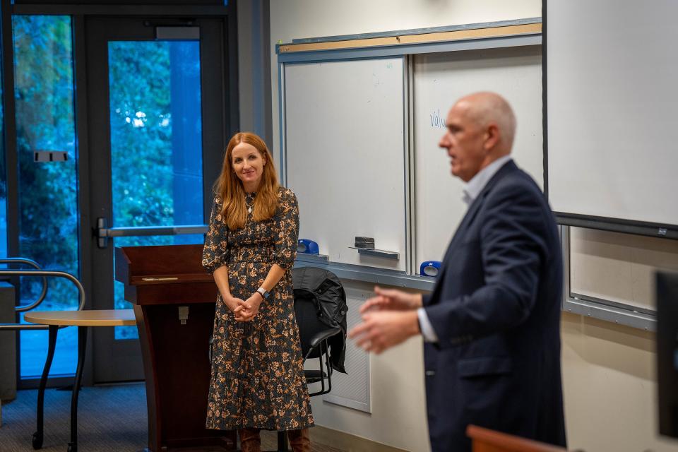 Vanessa Errecarte and Warner Thomas lecturing a class