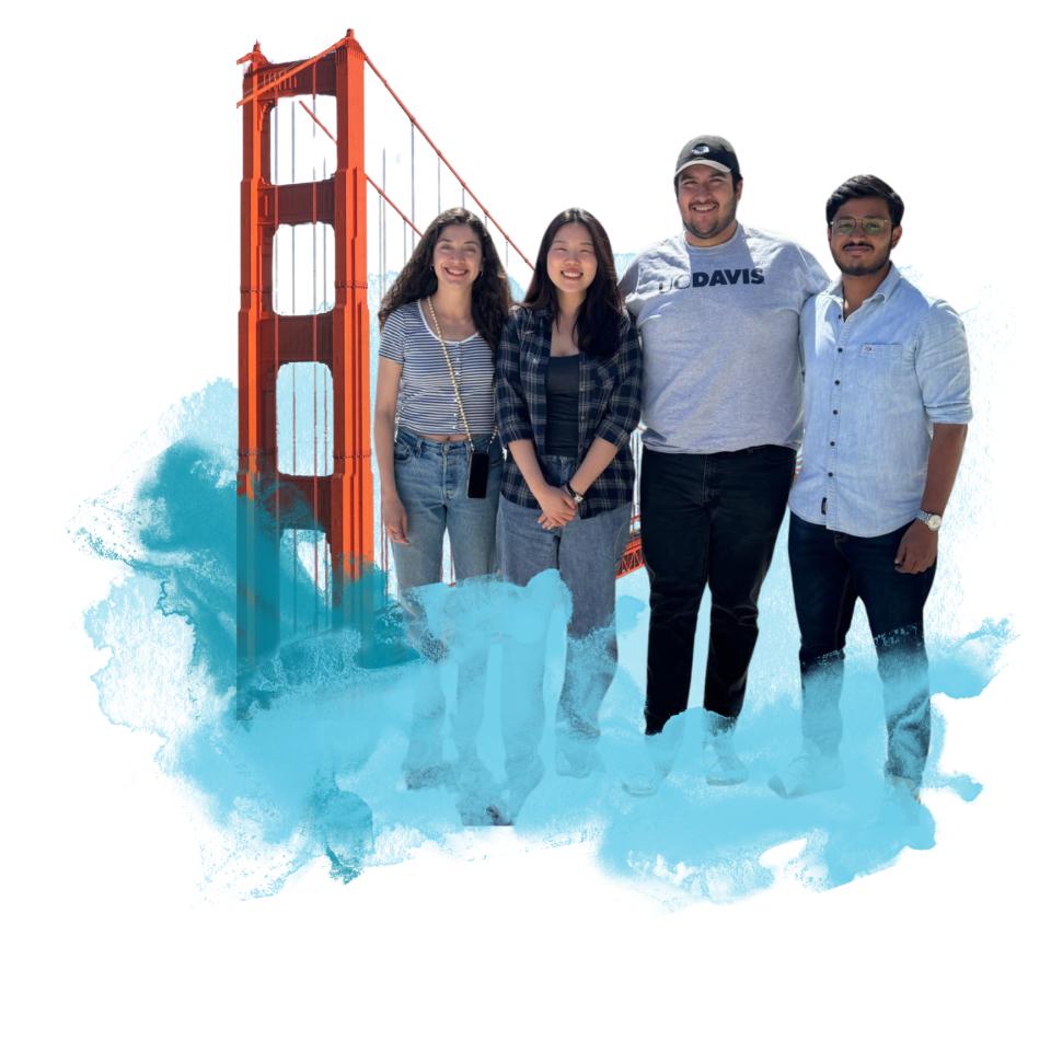 Four people standing in front of the Golden Gate bridge