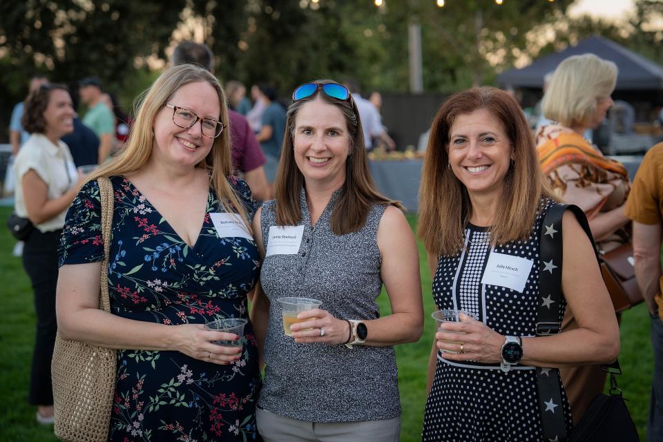 Bethany Wolf, Jamie Shattuck, Julie Hirsch gather at the social hour